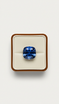 Cushion-cut blue sapphire with provenance card