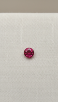 Round brilliant ruby with authenticity note