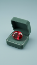 Burmese ruby in slate green velvet